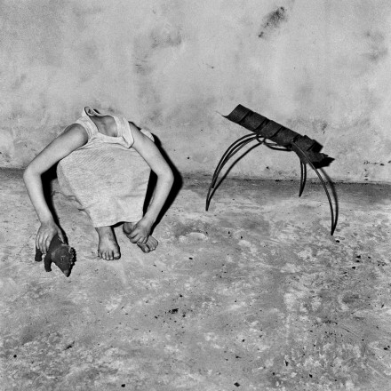 Photo by Roger Ballen: Head inside shirt